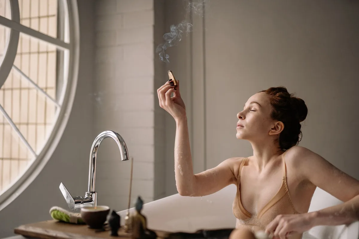A woman taking a few quiet minutes for a skincare routine at home